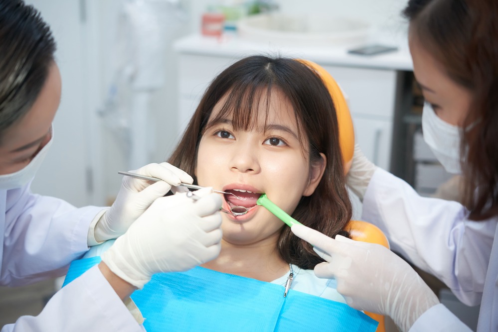 dentists-working-with-young-ethnic-girl-in-chair-2021-08-26-19-52-38-utc (1)