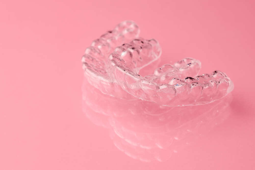 two-invisible-dental-teeth-aligners-on-the-pink-ba-2021-10-01-19-42-33-utc (1)