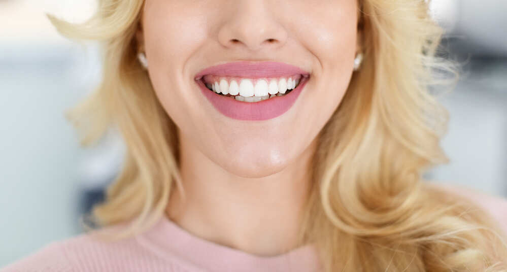 blonde-lady-showing-beautiful-white-teeth-cropped-2022-10-07-02-26-47-utc (1)
