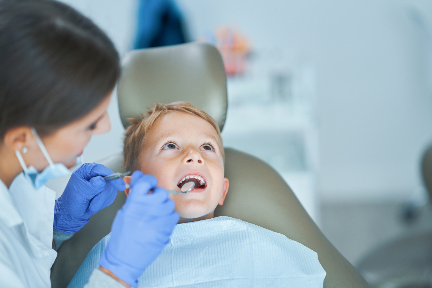 Little boy sitting in the dentists office