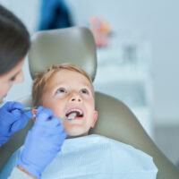 Little boy sitting in the dentists office